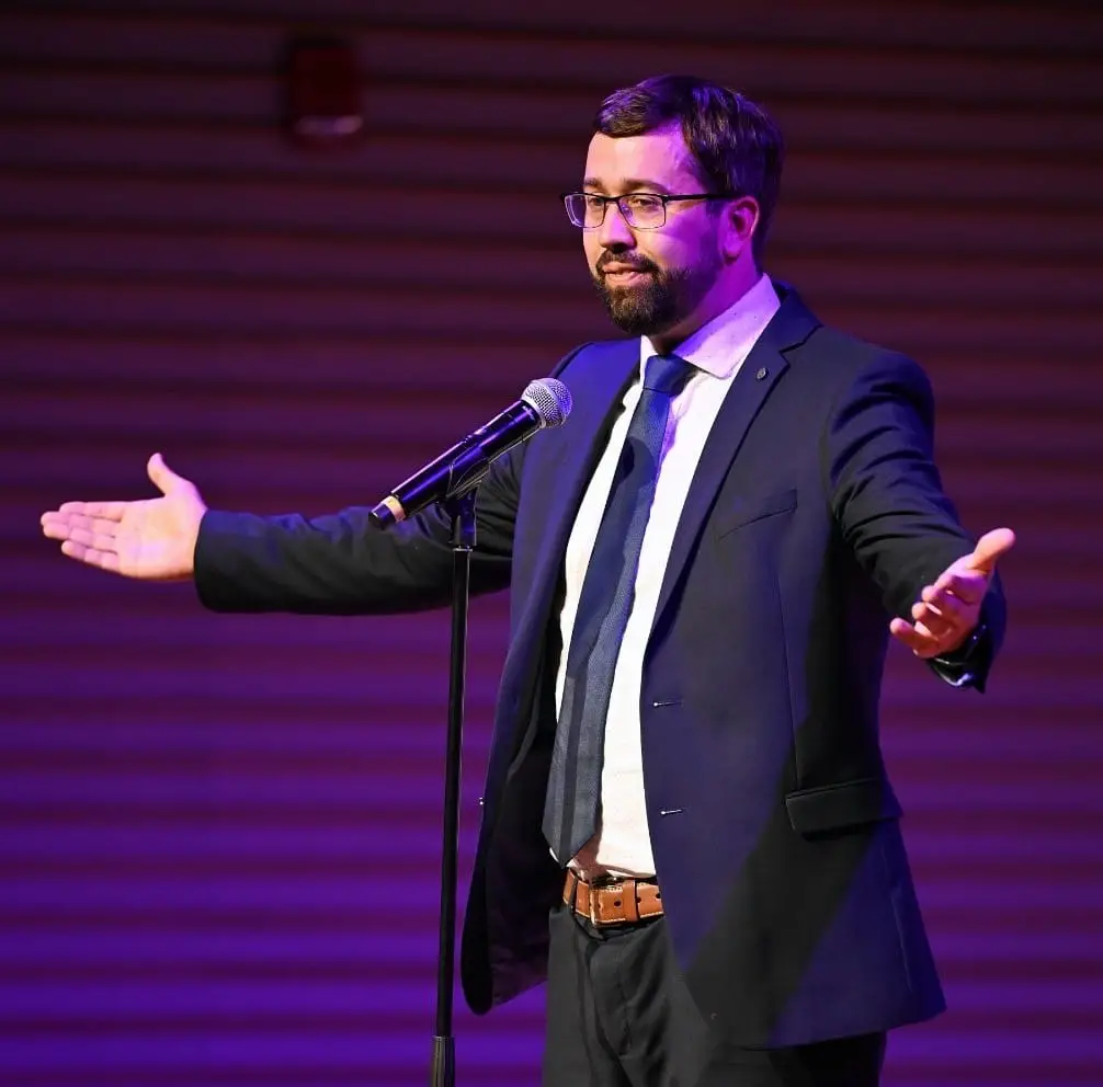 David Green smiling with microphone